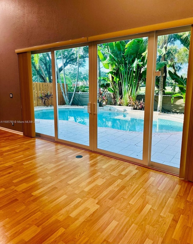 entryway featuring french doors and light hardwood / wood-style flooring