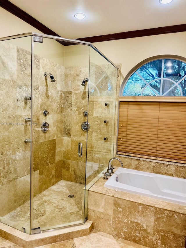 bathroom with independent shower and bath and ornamental molding