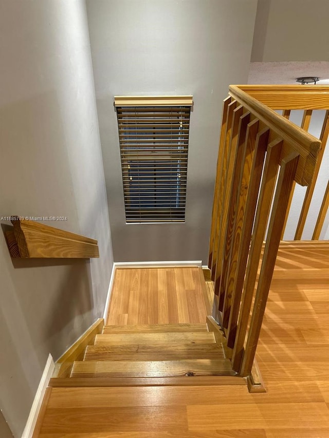 stairs with wood-type flooring