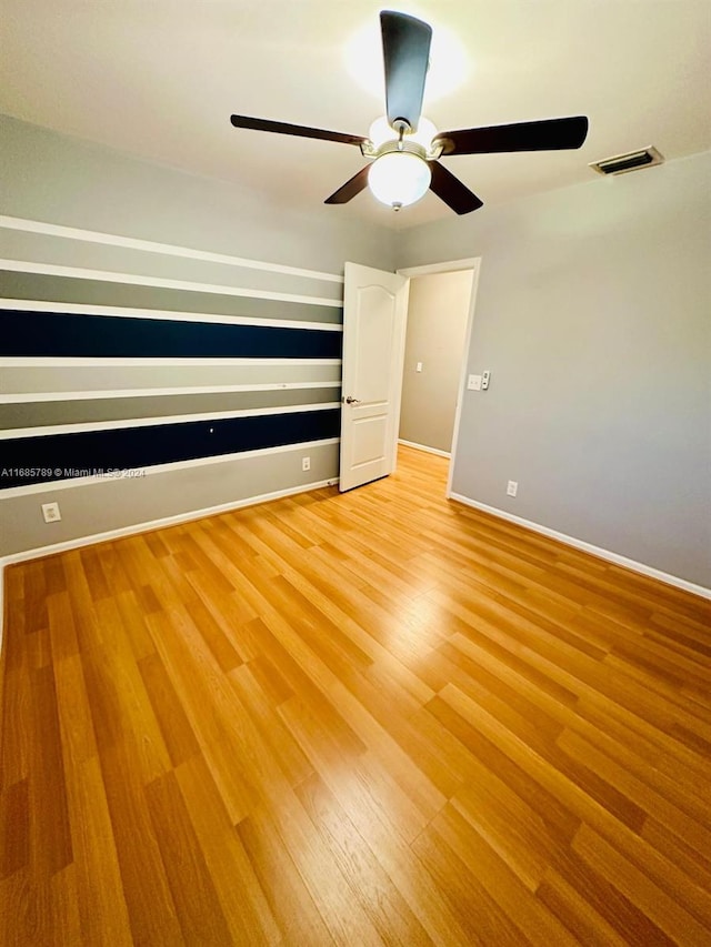 unfurnished bedroom featuring light hardwood / wood-style flooring and ceiling fan