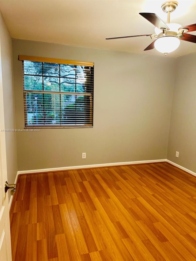 empty room featuring ceiling fan and wood-type flooring