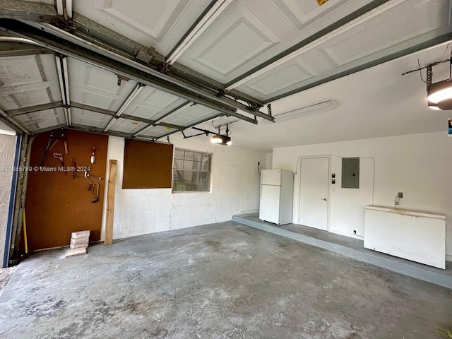 garage with a garage door opener, white fridge, electric panel, and refrigerator