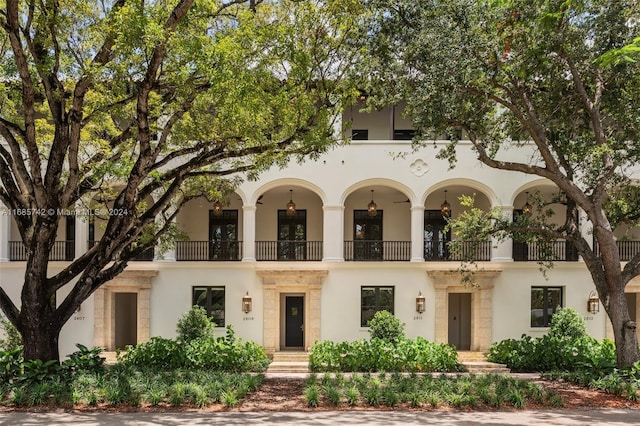 view of front of property with a balcony