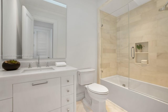 full bathroom with vanity, shower / bath combination with glass door, toilet, and tile patterned flooring