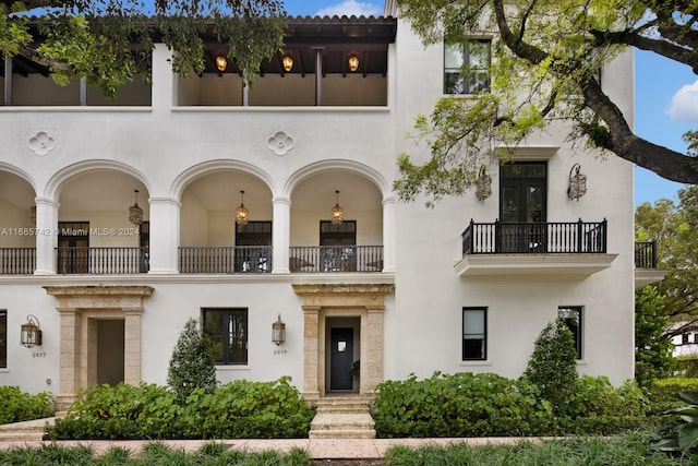 view of front of house featuring a balcony