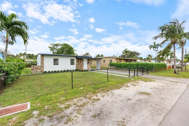 single story home with a front yard