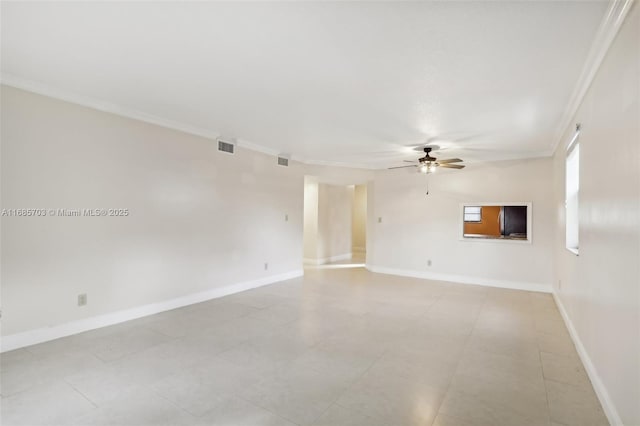 spare room with crown molding and ceiling fan