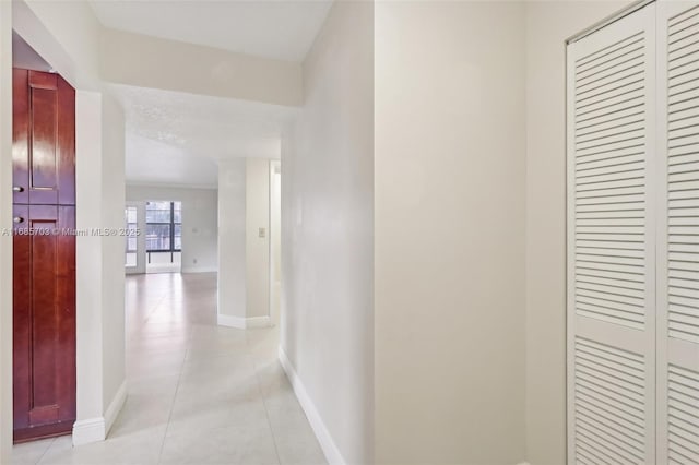 hallway with light tile patterned floors