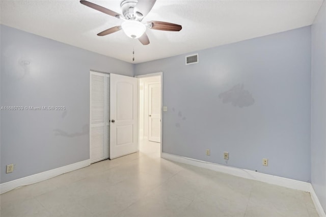 spare room with ceiling fan