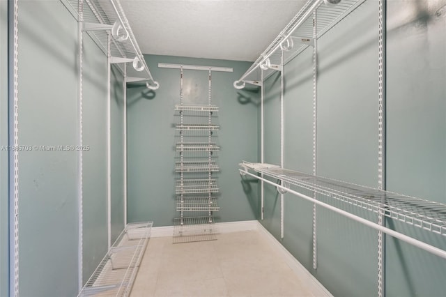 walk in closet featuring tile patterned floors