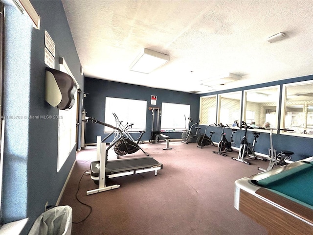 gym featuring a textured ceiling