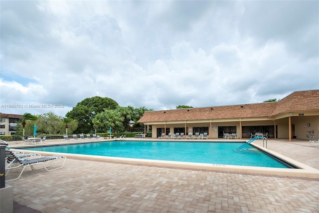 view of swimming pool with a patio