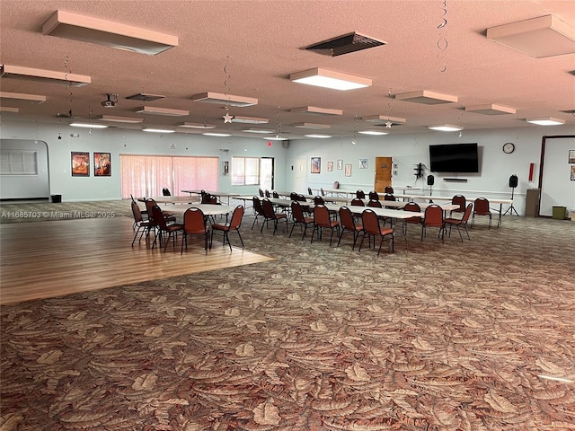 dining area with a textured ceiling