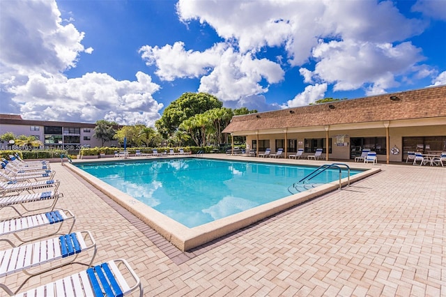 view of pool featuring a patio