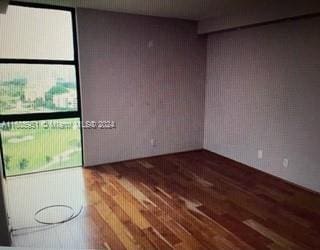 empty room featuring hardwood / wood-style floors