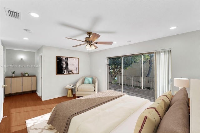 bedroom featuring access to outside, hardwood / wood-style floors, and ceiling fan