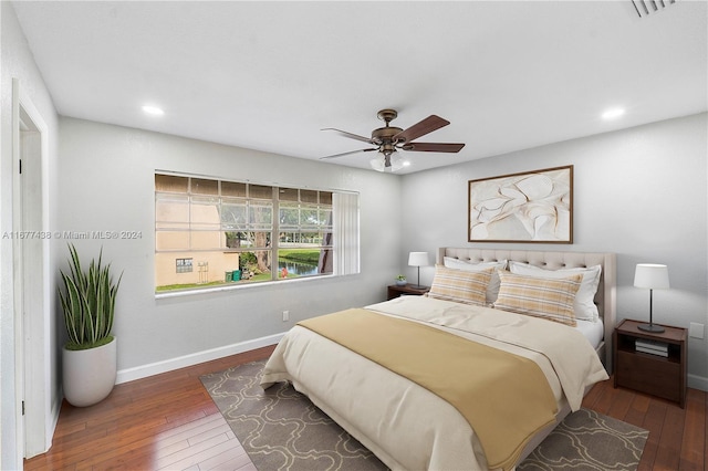 bedroom featuring ceiling fan and dark hardwood / wood-style floors