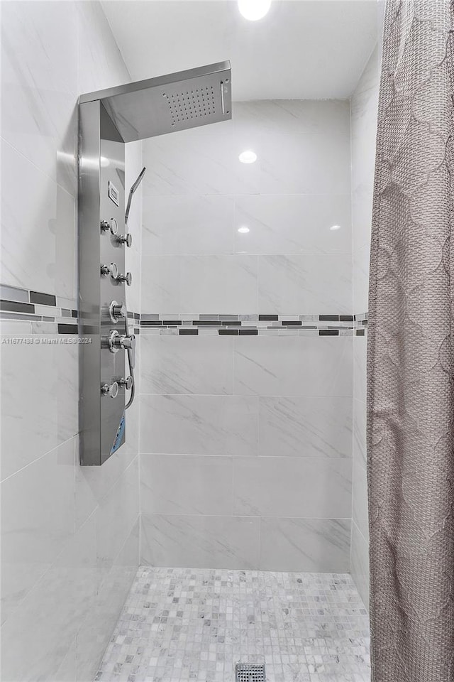 bathroom with a shower with shower curtain