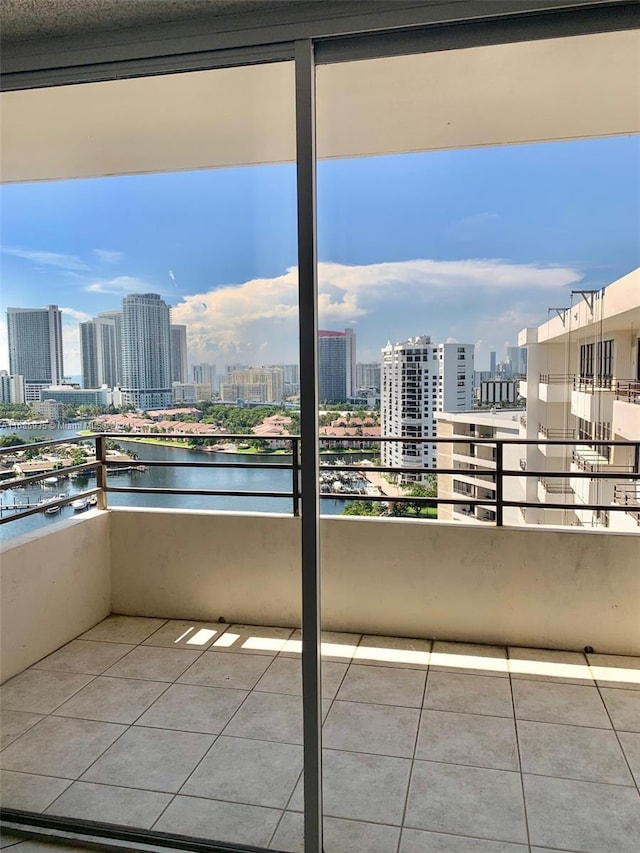 balcony featuring a water view