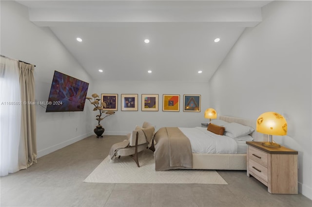 bedroom featuring lofted ceiling with beams