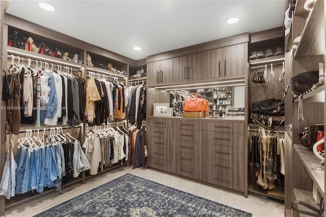 spacious closet featuring light tile patterned floors