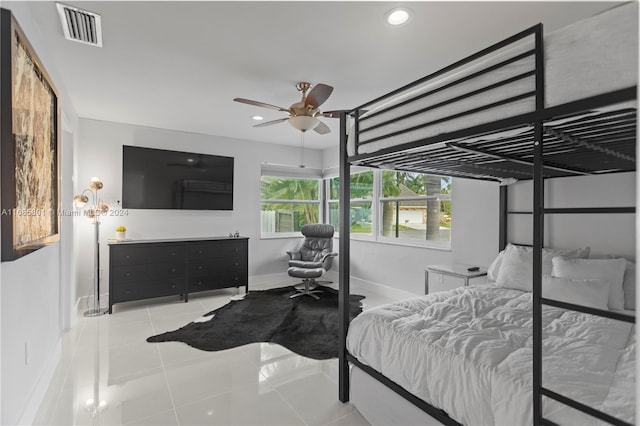 bedroom featuring ceiling fan and light tile patterned floors