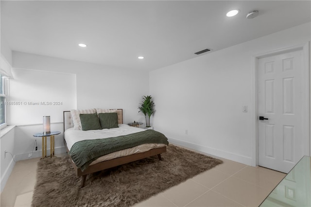 bedroom with light tile patterned flooring