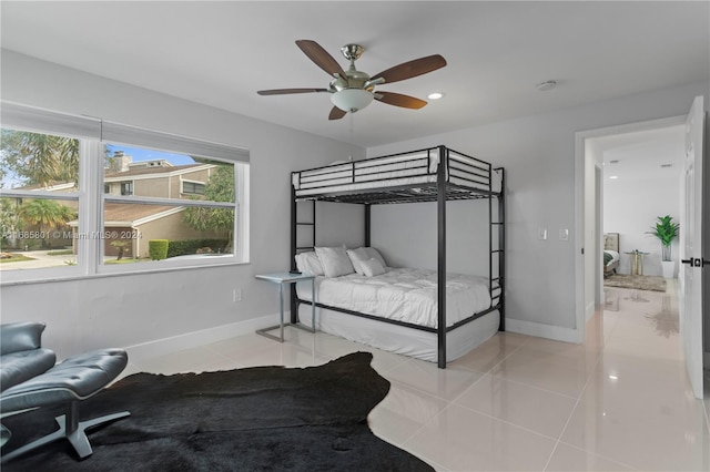 tiled bedroom with ceiling fan