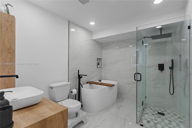 bathroom with shower with separate bathtub and toilet