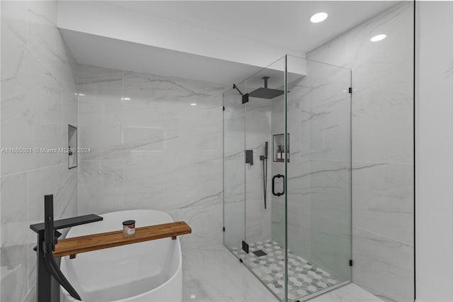 bathroom with a shower with shower door