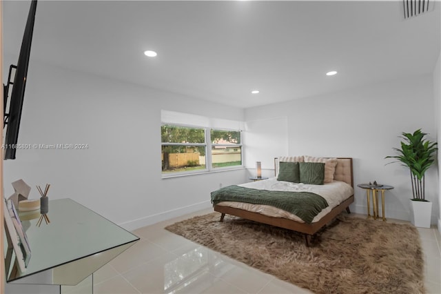 bedroom with light tile patterned floors