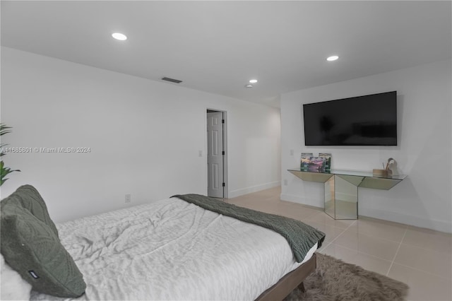 bedroom featuring light tile patterned floors