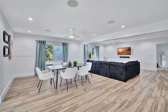 dining room featuring light hardwood / wood-style floors and ceiling fan