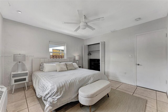 tiled bedroom featuring ceiling fan