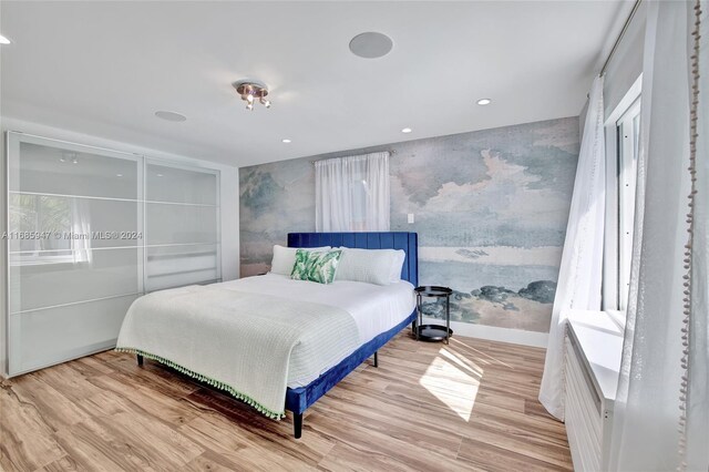 bedroom with light hardwood / wood-style floors