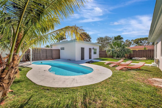 view of pool featuring a patio and a lawn