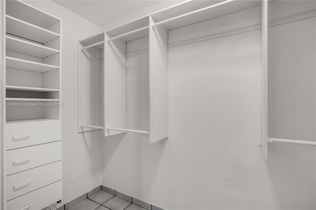 walk in closet featuring light tile patterned floors