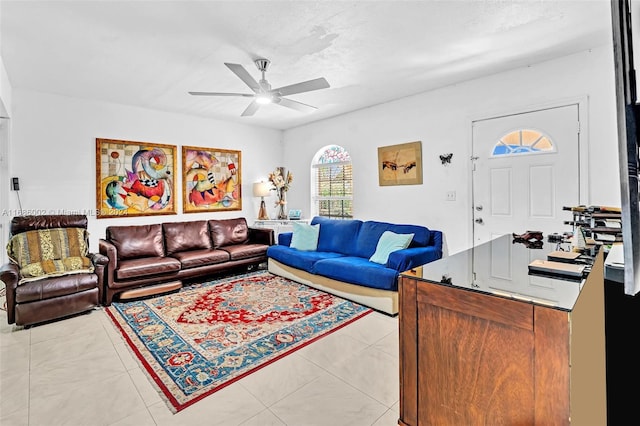 tiled living room with ceiling fan