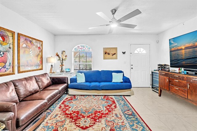 living room featuring light tile patterned floors and ceiling fan