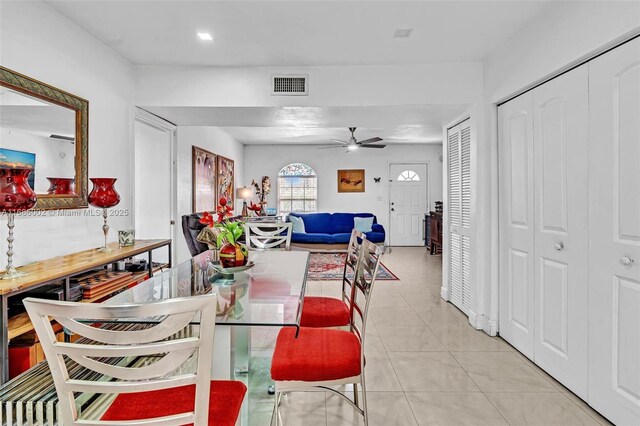 dining area with ceiling fan and light tile patterned floors