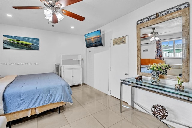 bedroom featuring ceiling fan, light tile patterned floors, and a wall mounted air conditioner