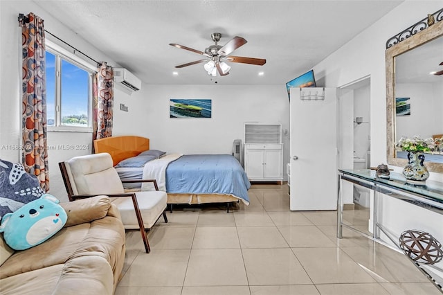 tiled bedroom with ceiling fan, an AC wall unit, and a textured ceiling