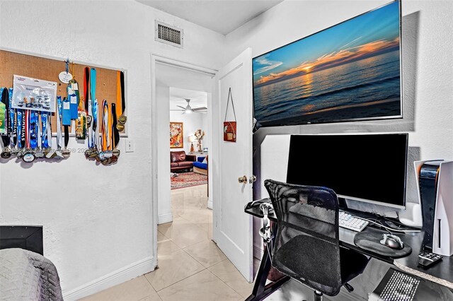 tiled home office with ceiling fan