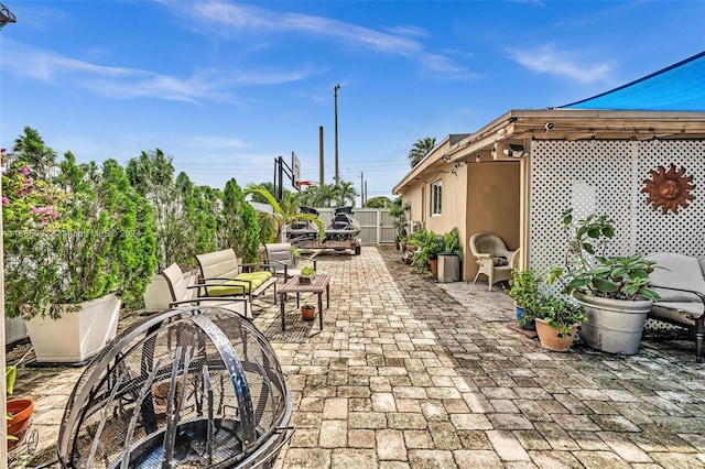 view of patio / terrace featuring an outdoor fire pit