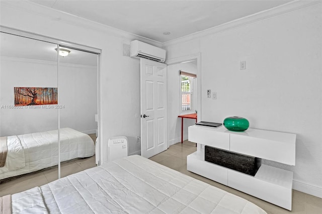 bedroom with an AC wall unit, ornamental molding, a closet, and tile patterned flooring