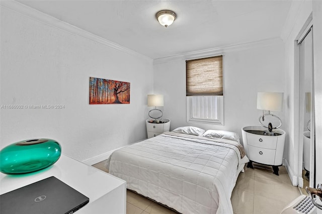 tiled bedroom featuring ornamental molding