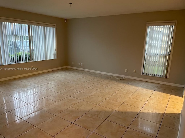 empty room with light tile patterned flooring