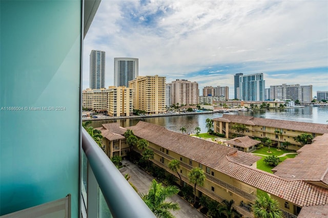 balcony featuring a water view