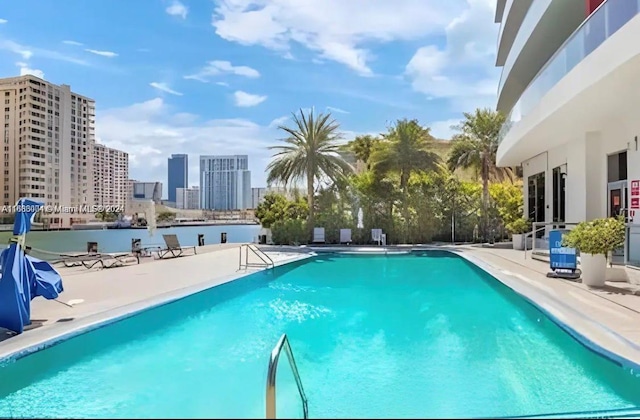 view of swimming pool featuring a patio area