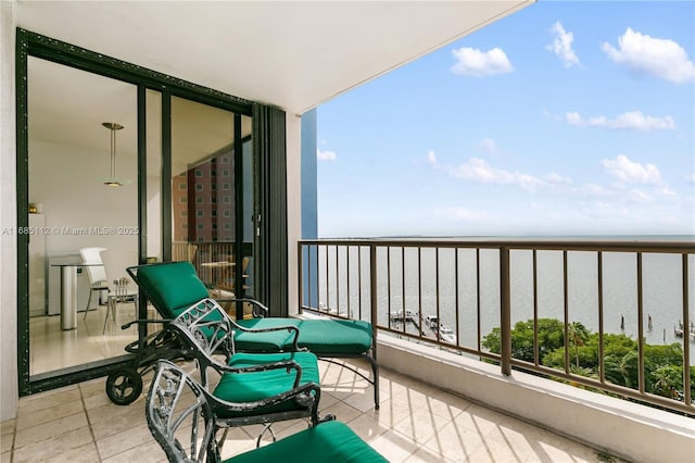 balcony featuring a water view